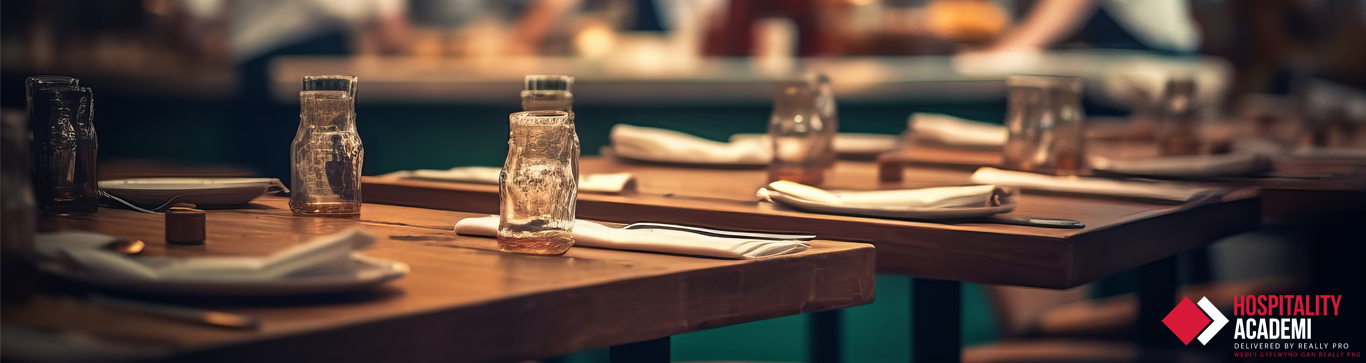 A group of laid out restaurant tables